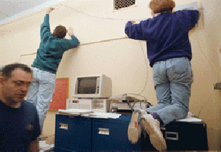 Picture of people wiring a classroom
